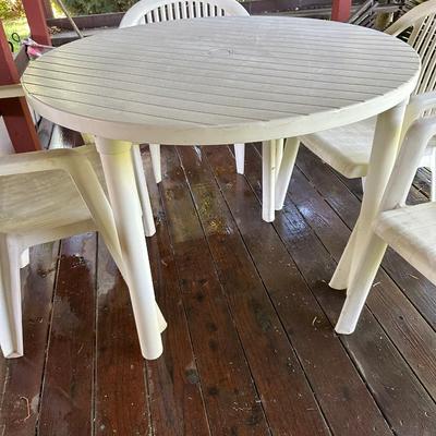 PLASTIC PATIO TABLE AND 4 CHAIRS