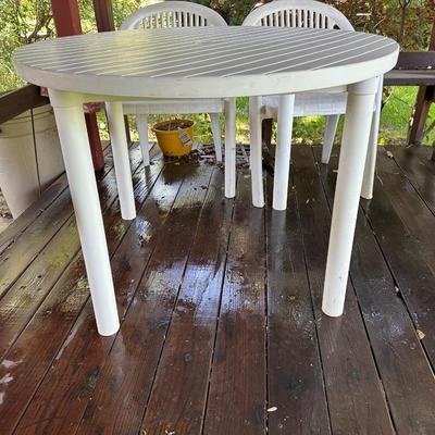 PLASTIC PATIO TABLE AND 4 CHAIRS