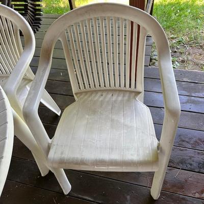 PLASTIC PATIO TABLE AND 4 CHAIRS
