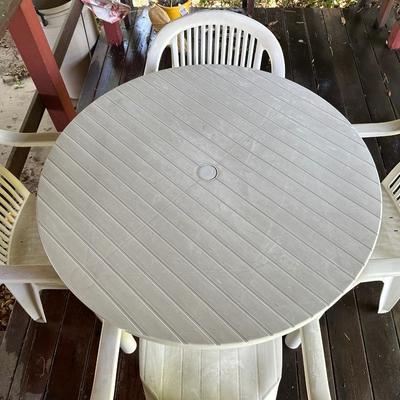PLASTIC PATIO TABLE AND 4 CHAIRS