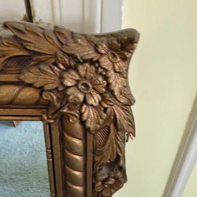 Sale Photo Thumbnail #61: This vintage JA Olson wall mirror features a giltwood frame in a gold finish, reflecting the mid-20th century era. Its rectangular shape allows for both vertical and horizontal orientation, making it suitable for hallways, lounges, or mantels. The mirror 