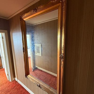 Sale Photo Thumbnail #77: This vintage-style, wall-mounted mirror features a rectangular shape with a gold wooden frame, perfect for adding a touch of elegance to your living room. The mirror is designed to be mounted on the wall, making it a practical and stylish addition to your