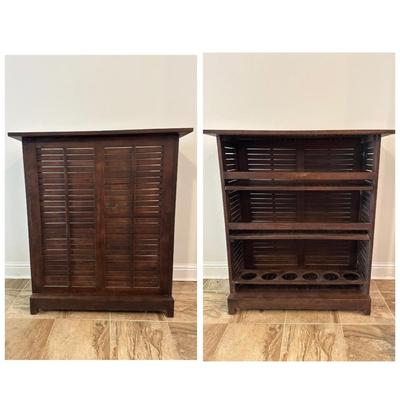 Sale Photo Thumbnail #12: Compact wooden bar cabinet with slatted sides and back, three open shelves, and a bottom rack with slots for storing up to 6 bottles. 

Dimensions: 43.5” tall x 39.5” wide x 16.5” deep