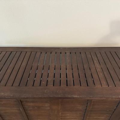 Sale Photo Thumbnail #6: Compact wooden bar cabinet with slatted sides and back, three open shelves, and a bottom rack with slots for storing up to 6 bottles. 

Dimensions: 43.5” tall x 39.5” wide x 16.5” deep