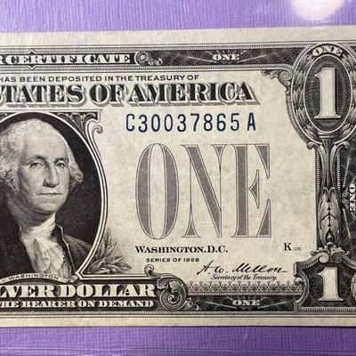 Series of 1928 Crisp AU/Uncirculated Condition "FUNNY BACK" Silver Certificate as Pictured.