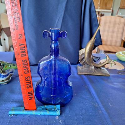 Sale Photo Thumbnail #69: Blue glass bottle.