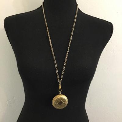 Vintage, circular gold tone, locket on chain necklace