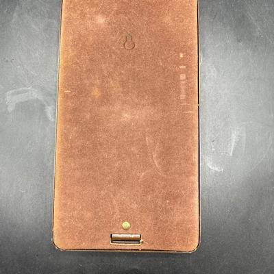 Sale Photo Thumbnail #396: Vintage from the early 1960’s.  Unused, filled with original cards.  Keeps phone numbers and other info alphabetically and has a sliding finder that allows the flip top to open at the letter desired.  Metal wood-tone case.  Very good condition.