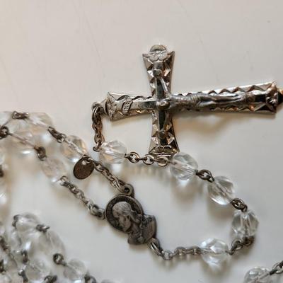 Sale Photo Thumbnail #50: This auction lot is for a Glass Bead Rosary.  This rosary has a handsome facited crucifix and central metal both marked Italy.  A beautiful rosary.