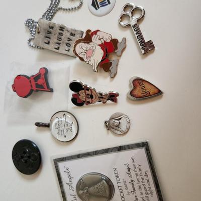 Sale Photo Thumbnail #77: This auction lot is for the Jewelry Box Finds.  These are small items that we found in the jewelry box after all the other contents have been gathered.  This group include a couple of nifty Disney Pins, a religious medal or two, a replacement button for y