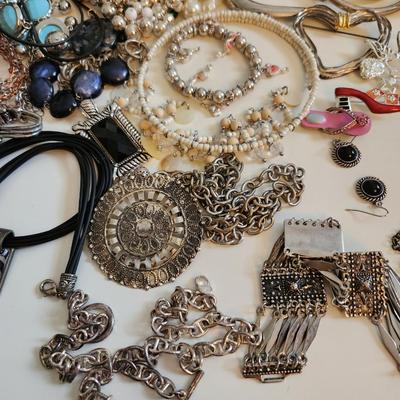 Sale Photo Thumbnail #95: This auction lot is for a Big Bag of Costume Jewelry.  This bag has bracelets, necklaces, bangles and bobbles.  Use or reuse them to your hearts desire.  Grab this big bag at a bargain and enjoy.