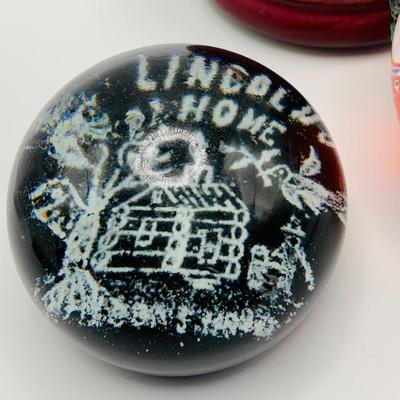 LOT 9: Lenox Glass Apple and Lincolns Home Glass Paperweight and a Philadelphia Snow Globe
