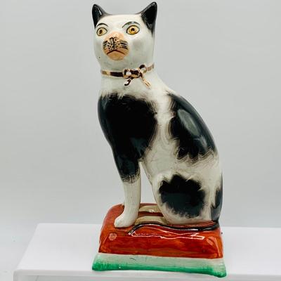 LOT 12: Old Staffordshire Cat Sitting of a Pillow, Royal Doulton Flambé Seated Cat