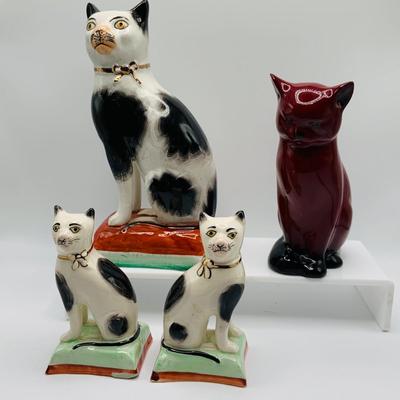 LOT 12: Old Staffordshire Cat Sitting of a Pillow, Royal Doulton Flambé Seated Cat