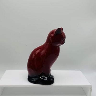 LOT 12: Old Staffordshire Cat Sitting of a Pillow, Royal Doulton Flambé Seated Cat