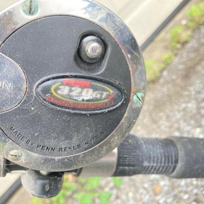 LOT 63: Collection of Three Fishing Rods and Reels - Daiwa, Okuma, Penn and Shimano