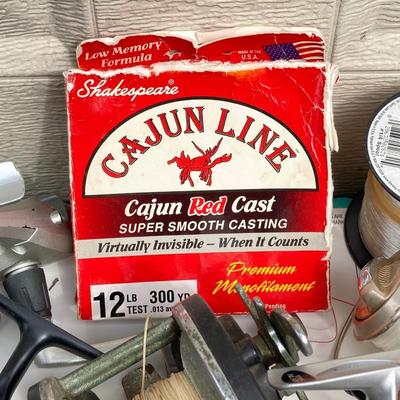 LOT 68: Fishing Reels and Line - (JC Higgins, Quantum, Shakespeare, Shimano and Storm)