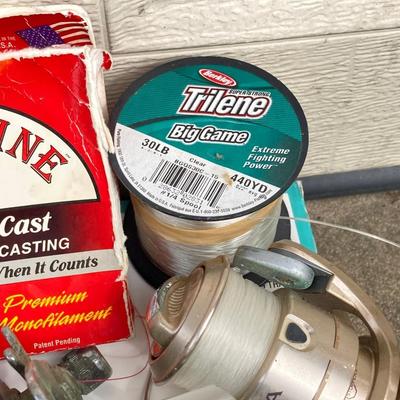 LOT 68: Fishing Reels and Line - (JC Higgins, Quantum, Shakespeare, Shimano and Storm)