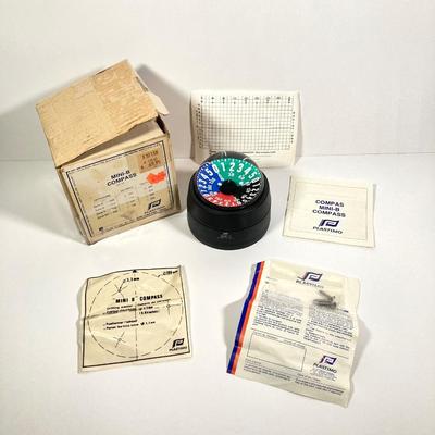 LOT 71: Plastimo Mini-B Compass in Original Box with Collection of Tackle, The Saltwater Fisherman's Bible and More