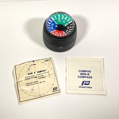 LOT 71: Plastimo Mini-B Compass in Original Box with Collection of Tackle, The Saltwater Fisherman's Bible and More