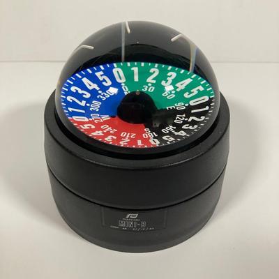 LOT 71: Plastimo Mini-B Compass in Original Box with Collection of Tackle, The Saltwater Fisherman's Bible and More