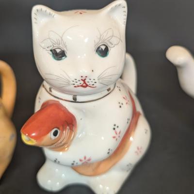 LOT 123: Zanolli Hand Painted Cat Planter along with Three Kitten Teapots