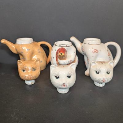 LOT 123: Zanolli Hand Painted Cat Planter along with Three Kitten Teapots
