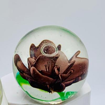 LOT 167: Collection of Art Glass Floral Pattern Paperweights and a Wheaton Brown Ribbon Paperweight