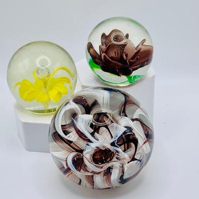 LOT 167: Collection of Art Glass Floral Pattern Paperweights and a Wheaton Brown Ribbon Paperweight