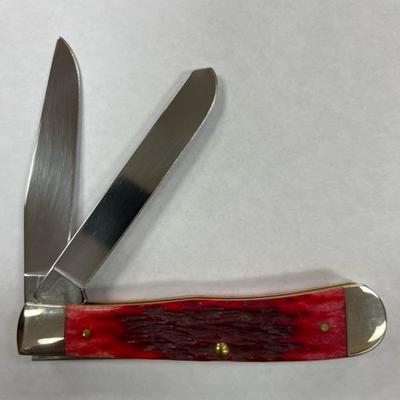 Sale Photo Thumbnail #149: Case XX Red Bone Peach Seed Jig Trapper 6254 CV  Item No 31950  Include original Box   This knife is part of a collectors estate  This knife has not been used or carried on displayed  build date 01/09/23