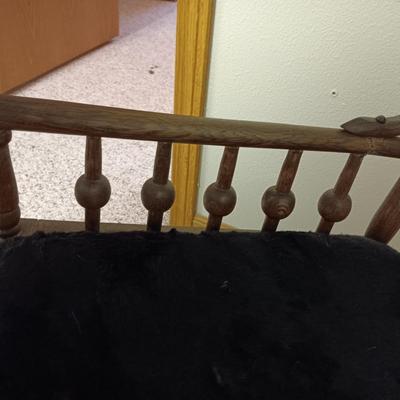 ANTIQUE GLIDER ON CASTERS WITH A VELVET COVERED SEAT