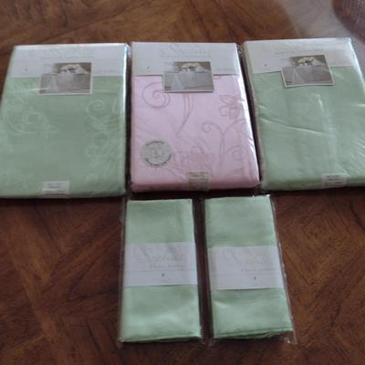 Collection of Table Cloths and Napkins- New in Package