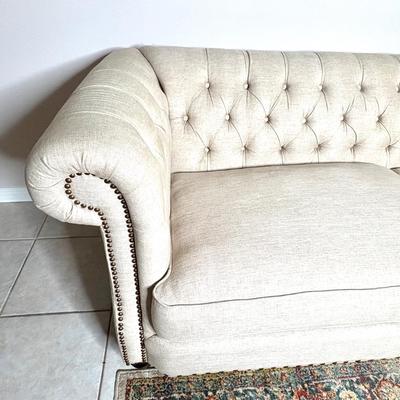 Tufted Cream Colored Sofa with Nail Head Trim