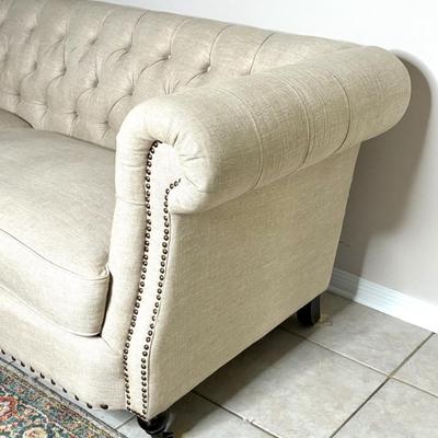 Tufted Cream Colored Sofa with Nail Head Trim