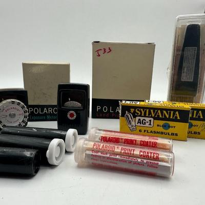 Sale Photo Thumbnail #40: Wow!  This is the most comprehensive vintage camera set we've ever come across!  Everything you could ever want for the 1950's Polaroid including sealed film, flash aka Wink Light, meters, carrying case, film paper, print coat and all the manuals you can 