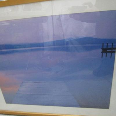 Framed picture of a lake and dock