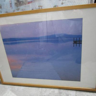 Framed picture of a lake and dock
