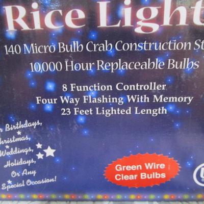 New in box Rice lights, green wire, clear bulbs