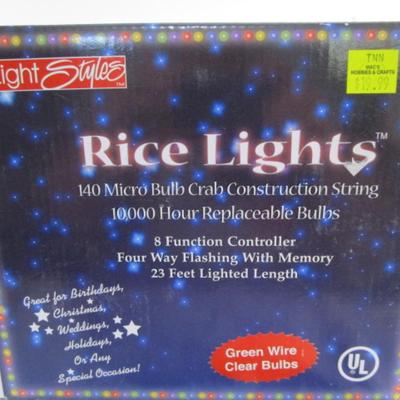 New in box Rice lights, green wire, clear bulbs