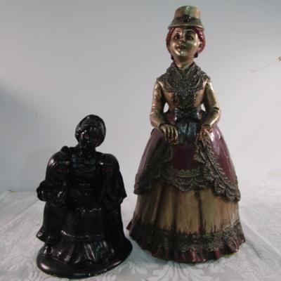 2 statuettes, 1 is mom with 2 kids, 1 Victorian woman