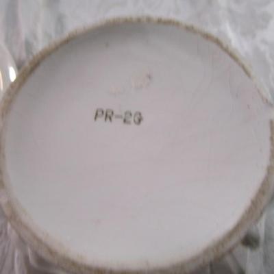 2 small decorative plates, 1 ceramic jar with lid