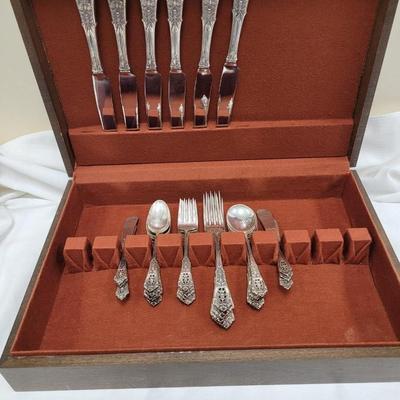Sale Photo Thumbnail #440: Service for 6, and storage box
Dinner knives, butter knives, dinner forks, salad forks, teaspoons, soup spoons
excellent condition 
retails at $3200 +