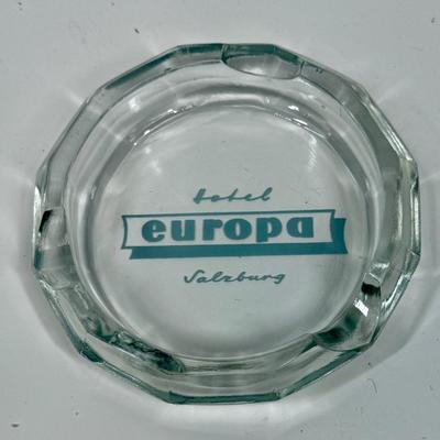 Sale Photo Thumbnail #581: 12-sided, faceted on the outside but round on the inside.  Hotel Europa Salzburg logo on the bottom. Good condition.