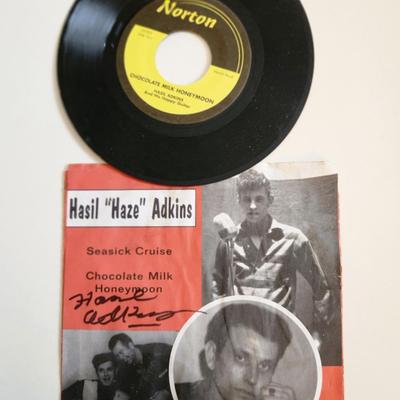 Sale Photo Thumbnail #247: This auction lot is for an Autographed Hasil Adkins 45RPM.  This record is of Seasick Cruise.  The record comes with the autographed sleeve which has some moisture issues.  The record itself is in fine condition.  Hasil Adkins was an American singer-songw