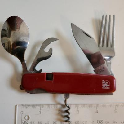 Sale Photo Thumbnail #284: This auction lot is for a Field Gear Dining/Kitchen Knife.  This Knife has a blade, a fork, a spoon, a can/bottle opener and a corkscrew.  Almost a cutlery drawer in a folding knife,  Ready for your next big hike or camp out.  See photos for sizing.
