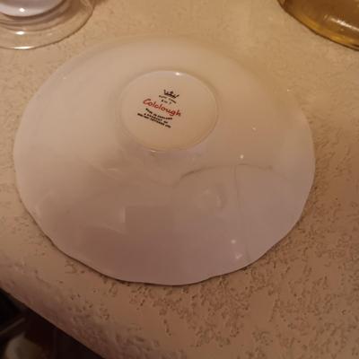 YELLOW GLASS BASKET AND 2 TEA CUPS AND SAUCER SETS