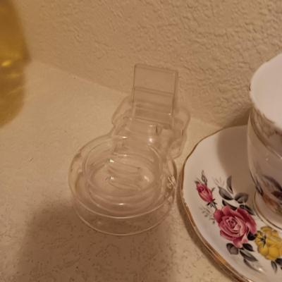 YELLOW GLASS BASKET AND 2 TEA CUPS AND SAUCER SETS