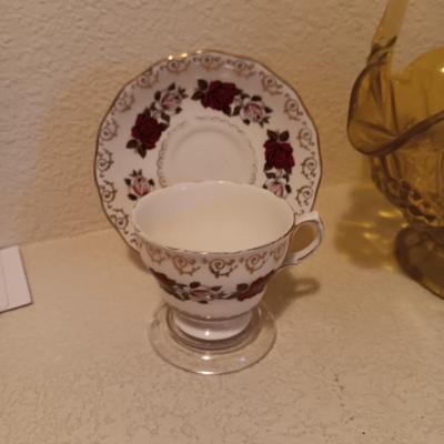 YELLOW GLASS BASKET AND 2 TEA CUPS AND SAUCER SETS