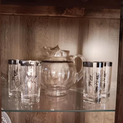 GLASS PITCHER AND DRINKING GLASSES WITH A SILVER BAND