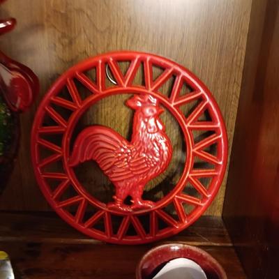 MULTI COLORED GLASS ROOSTER, CAST IRON TRIVET, CLAY EGG SEPARATOR & GLASS CREAM CONTAINER